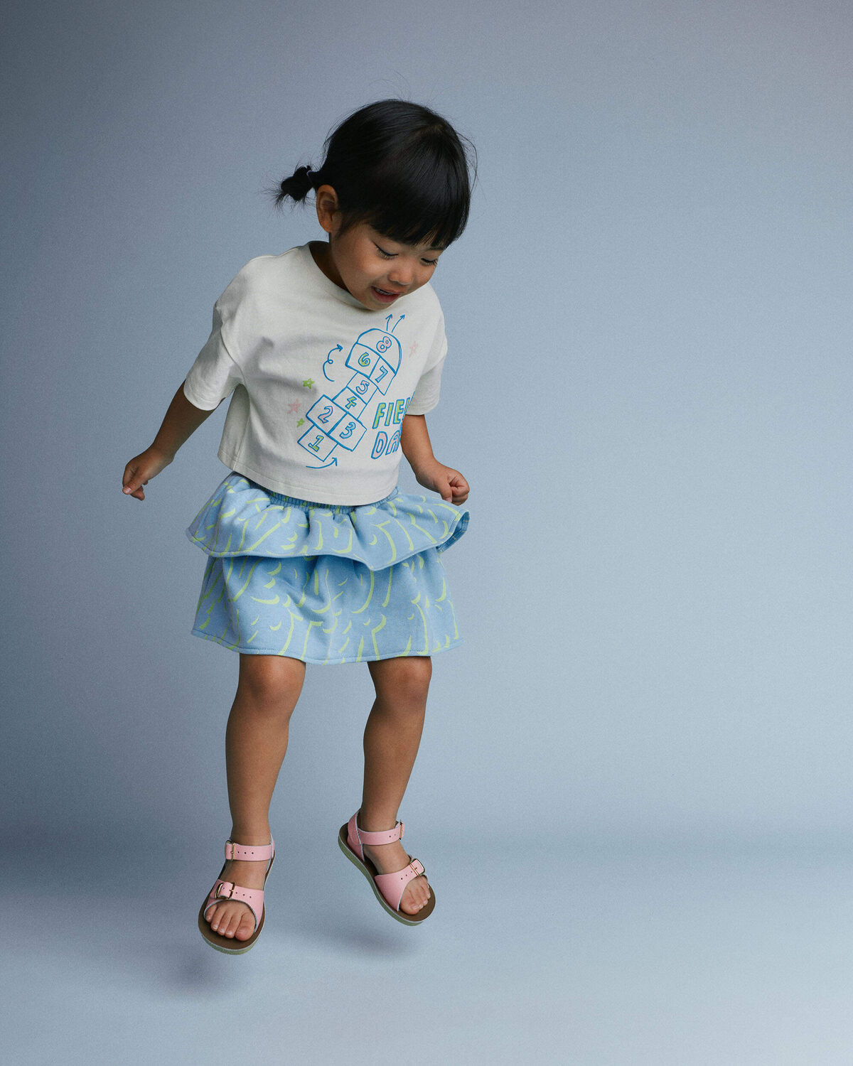 Toddler Girl 'Field Day' Breezy Top in Hopscotch Print - Cream 1 Toddler Girl 'Field Day' Breezy Top in Hopscotch Print - Cream