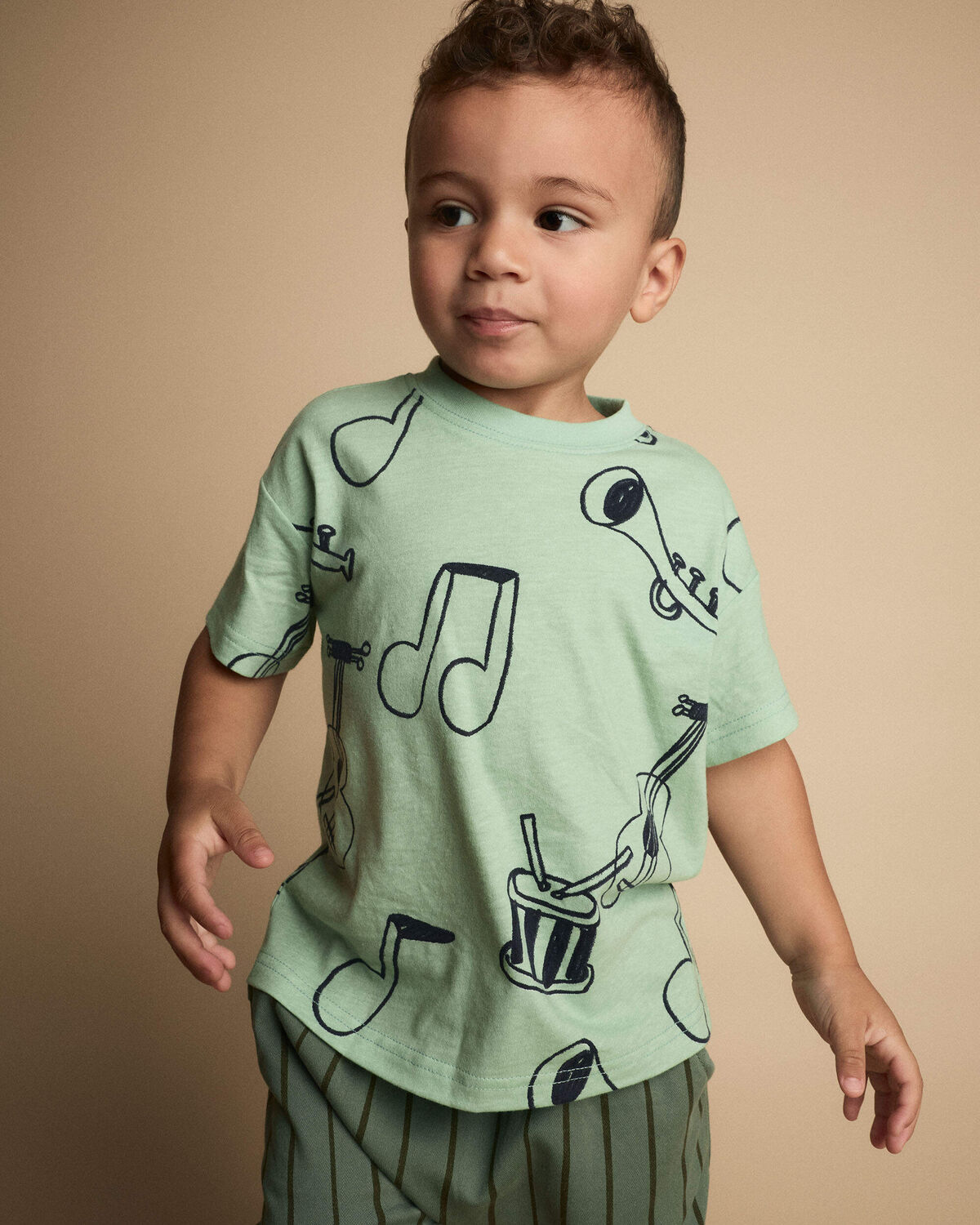 Toddler Relaxed Graphic Tee in Music Print - Green 1 Toddler Relaxed Graphic Tee in Music Print - Green