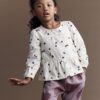 Toddler Girl Peplum Long-Sleeve Top with Shapes - Ivory 13 Toddler Girl Peplum Long-Sleeve Top with Shapes - Ivory